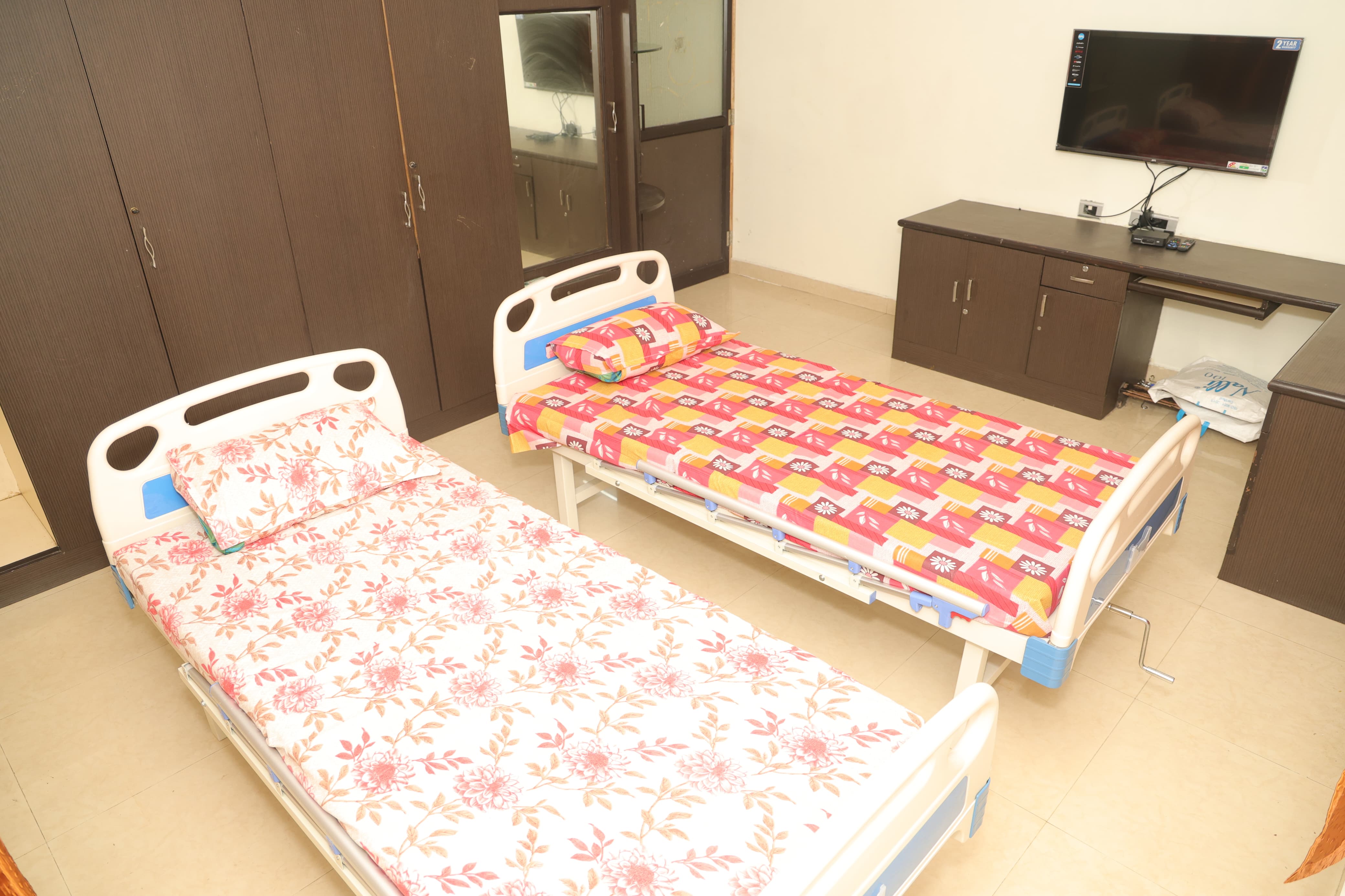 Modern bedrooms for elders at Waves Home Old Age Home Mogappair